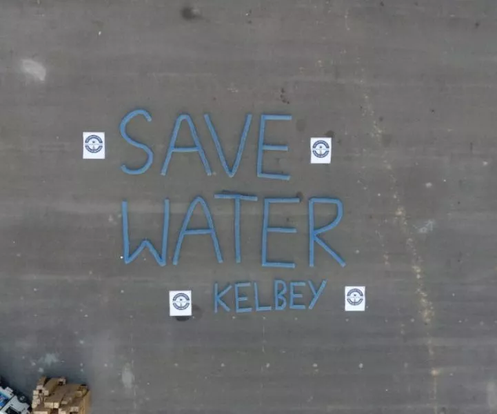LARGEST SLOGAN “SAVE WATER – KELBEY” USING WATER BOTTLES