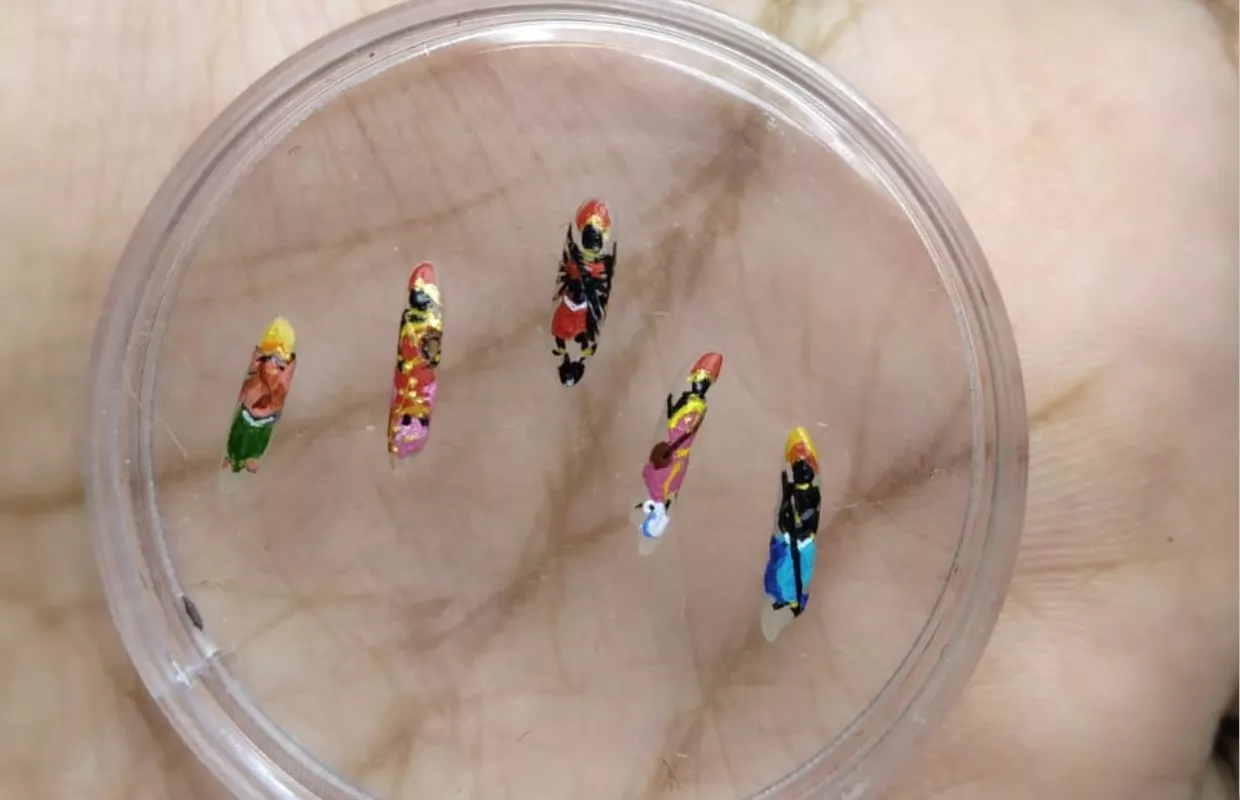 SMALLEST DURGA FAMILY PAINTED ON RICE GRAINS