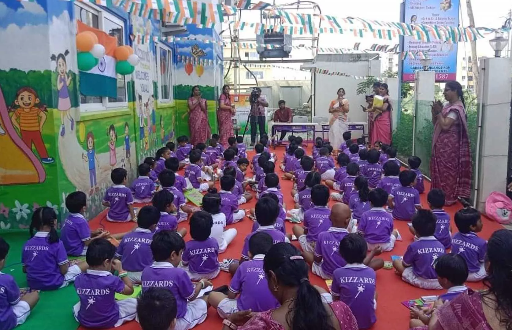 MOST STUDENTS OF KINDERGARTEN COLORING INDIAN NATIONAL FLAG INDIVIDUALLY
